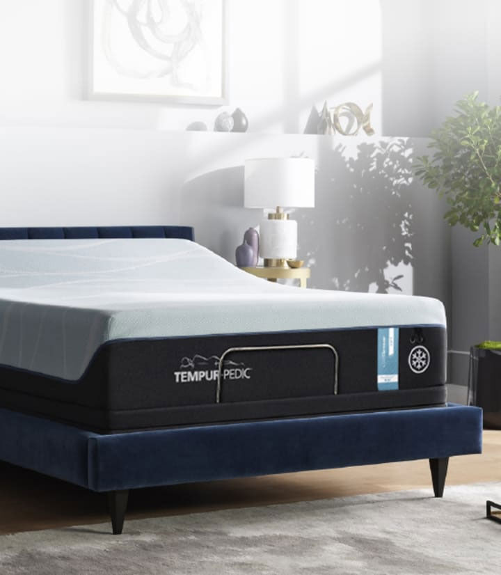 a bed with a blue cover