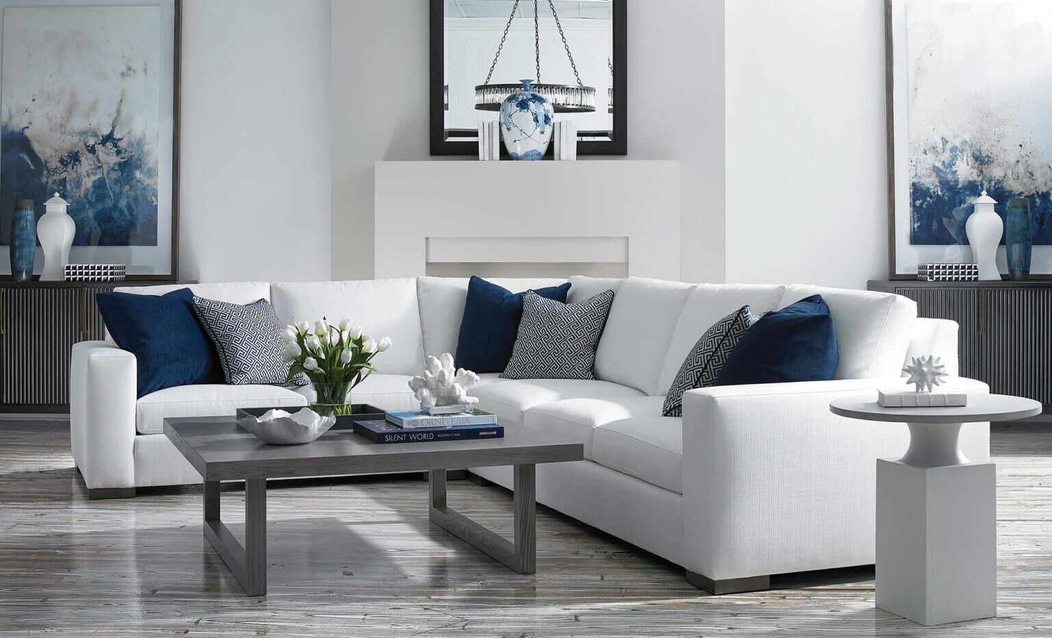 a white couch with blue pillows