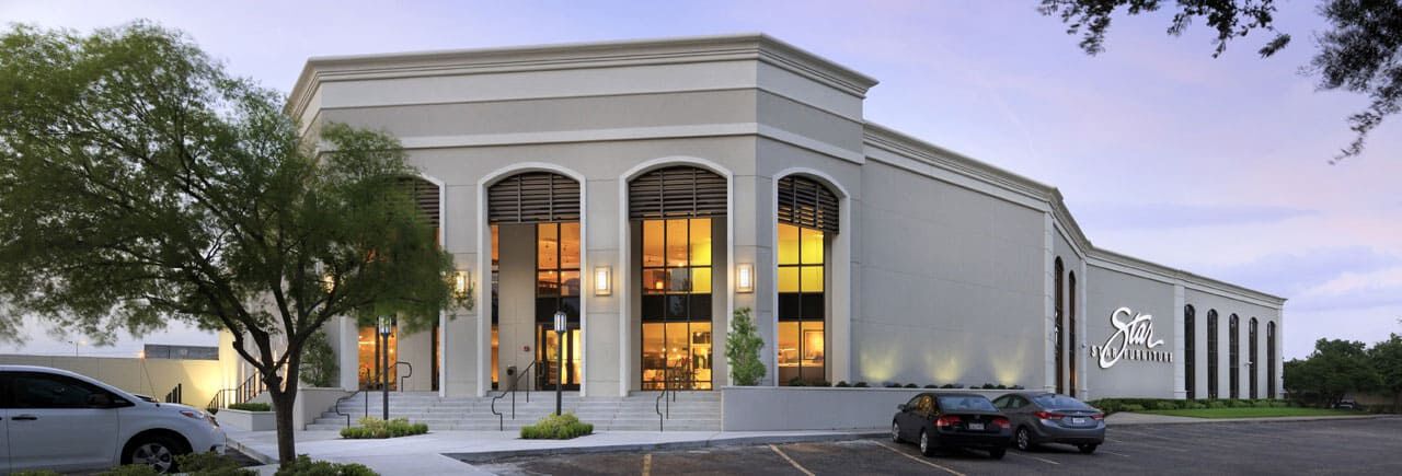 a building with cars parked in front